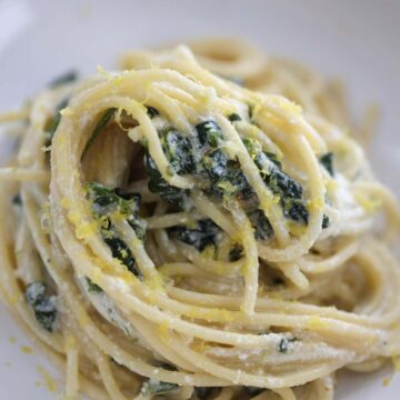 lemon ricotta pasta in a white dish up close.