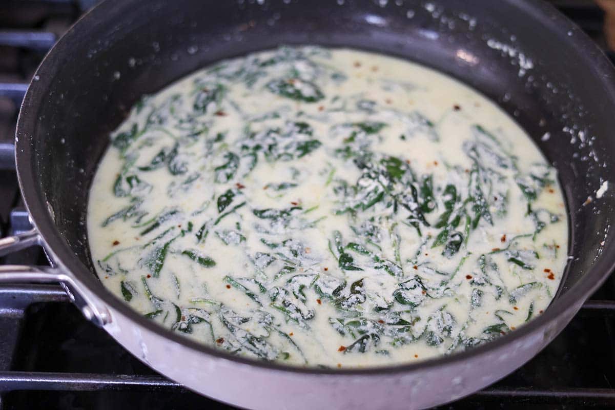 ricotta sauce with spinach in a skillet. 