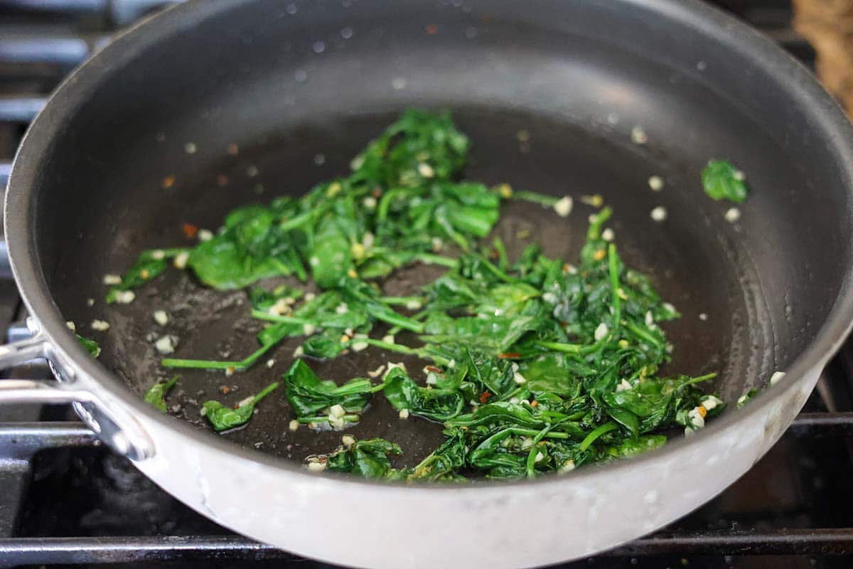 sauteed spinach in a skillet. 