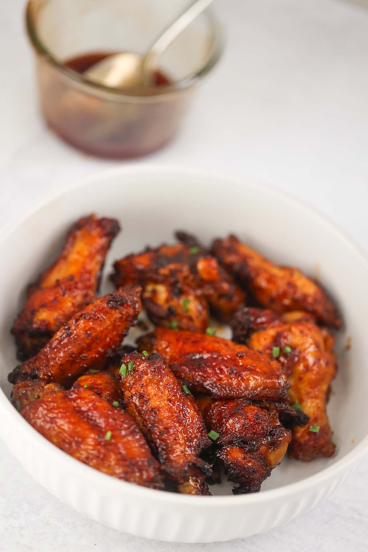 honey bbq chicken wings on a white plate. 