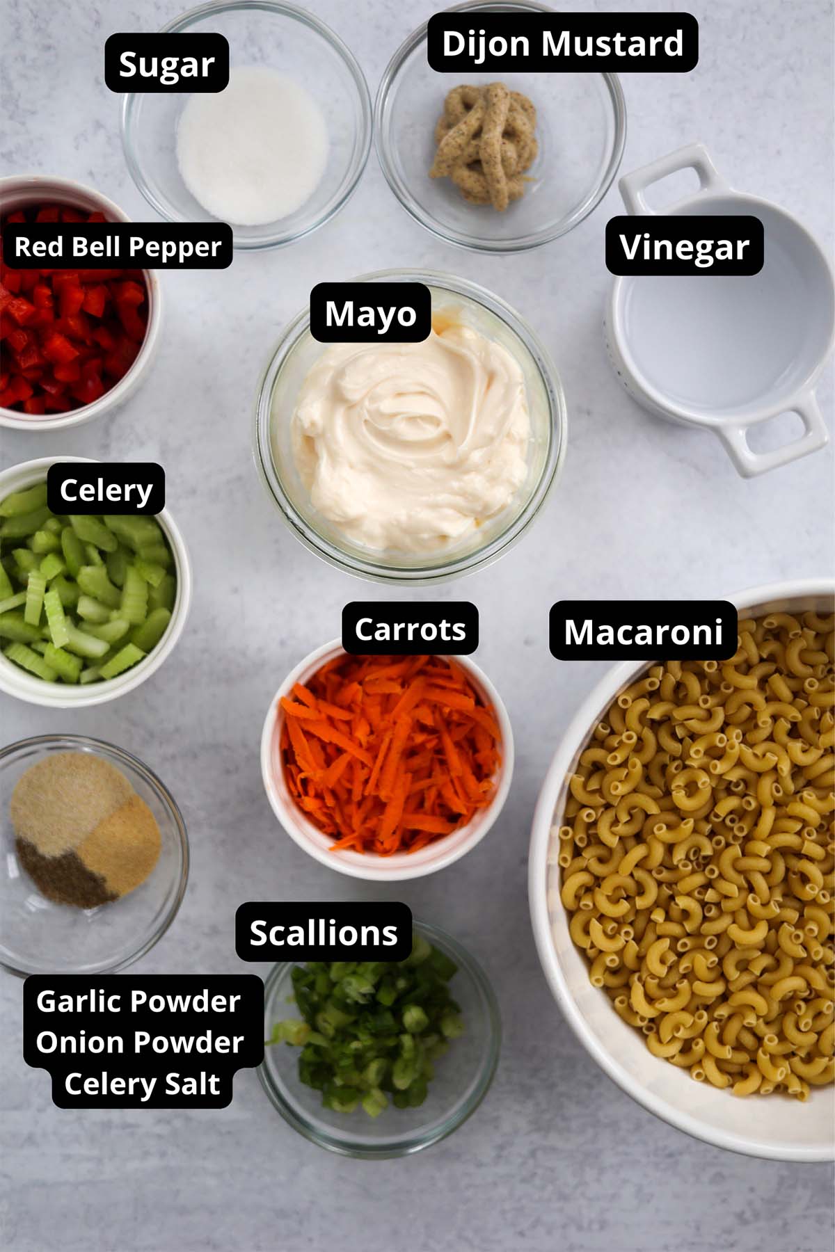 Labeled ingredients for deli style macaroni salad. 