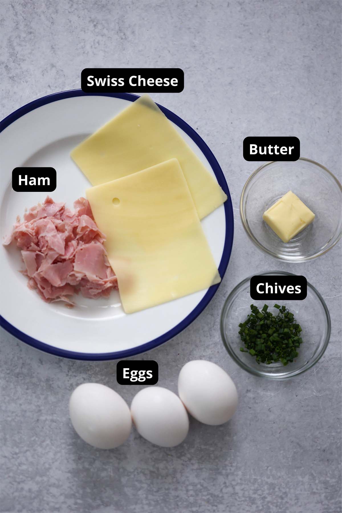 Labeled ingredients for ham and cheese omelet recipe. 