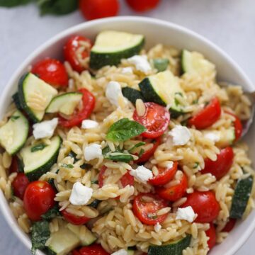 lemon orzo pasta salad in a white bowl.