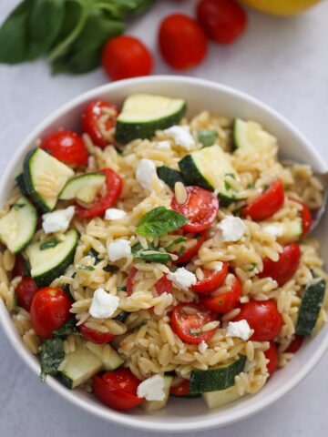 lemon orzo pasta salad in a white bowl.