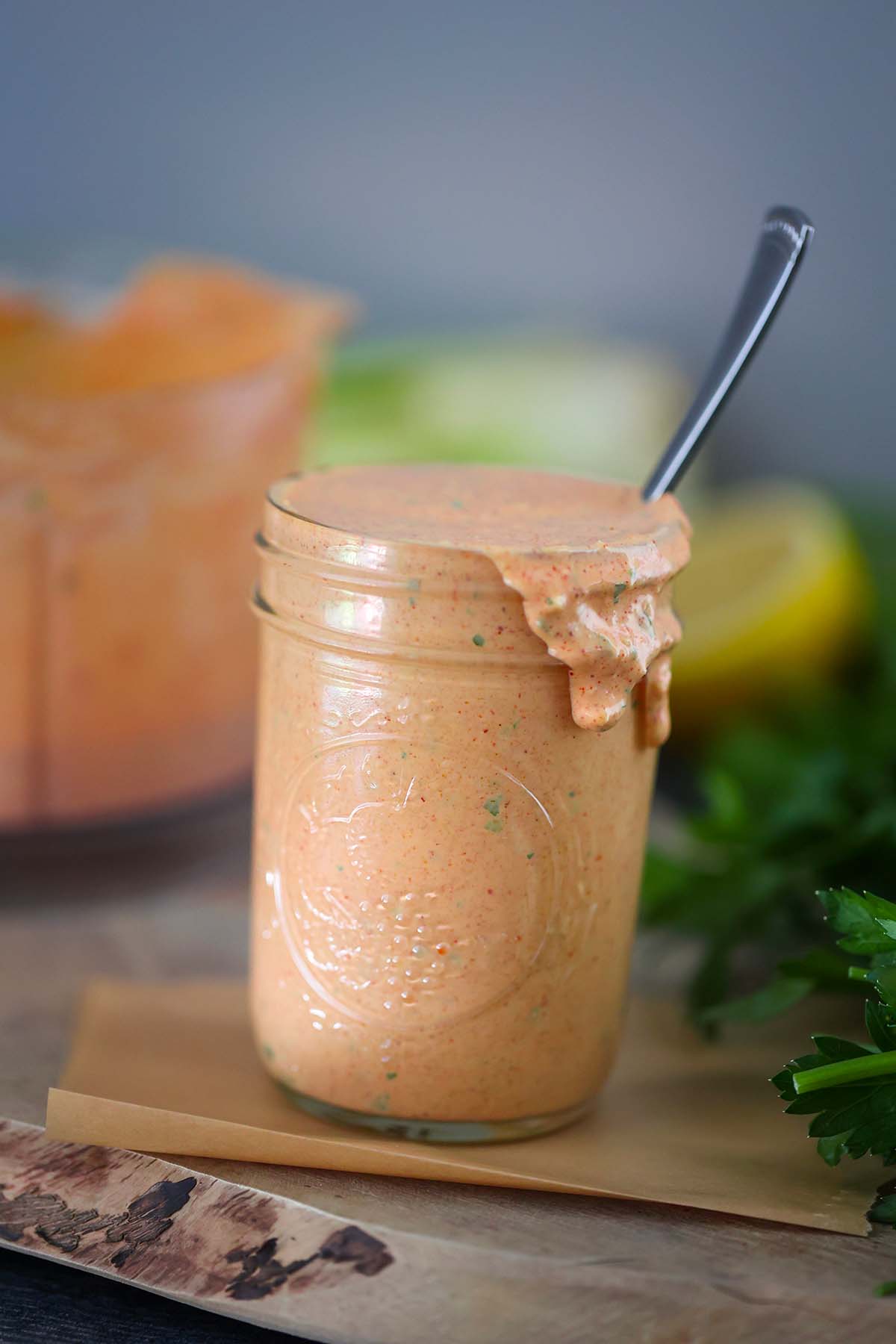 remoulade sauce in a mason jar with a spoon. 