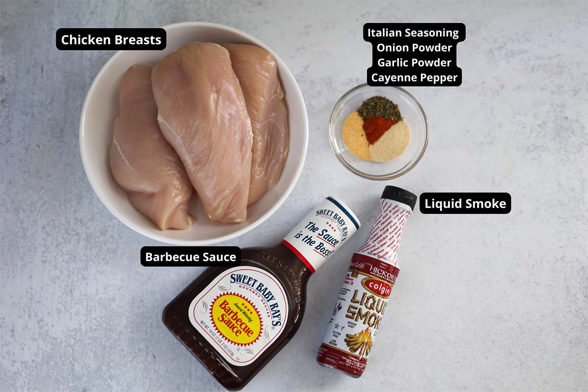 Labeled ingredients for slow cooker BBQ chicken recipe. 