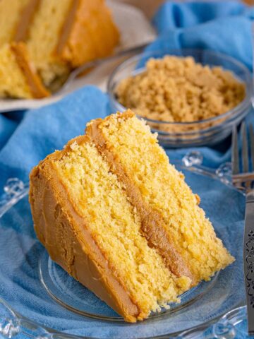 a slice of caramel cake with a fork on the side.