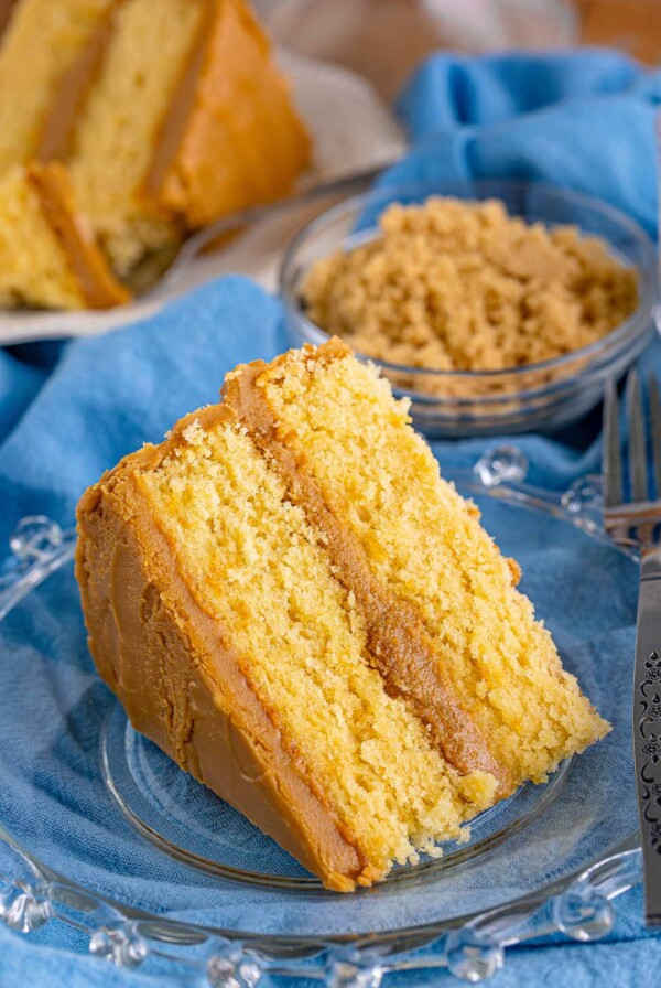 a slice of caramel cake with a fork on the side.