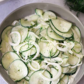 creamy cucumber salad in a bowl.