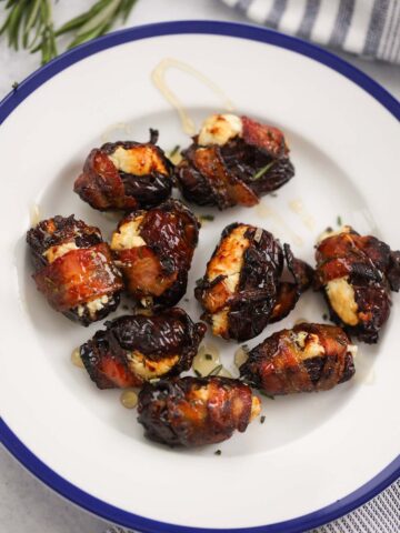 air fryer goat cheese bacon wrapped dates on a plate.
