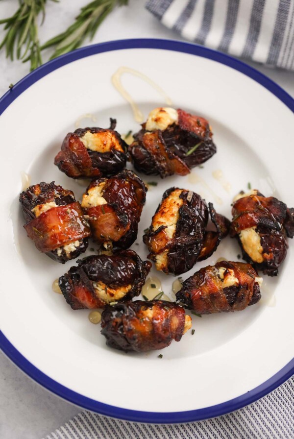 air fryer goat cheese bacon wrapped dates on a plate.