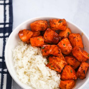 hot honey salmon bites with white rice on the side.