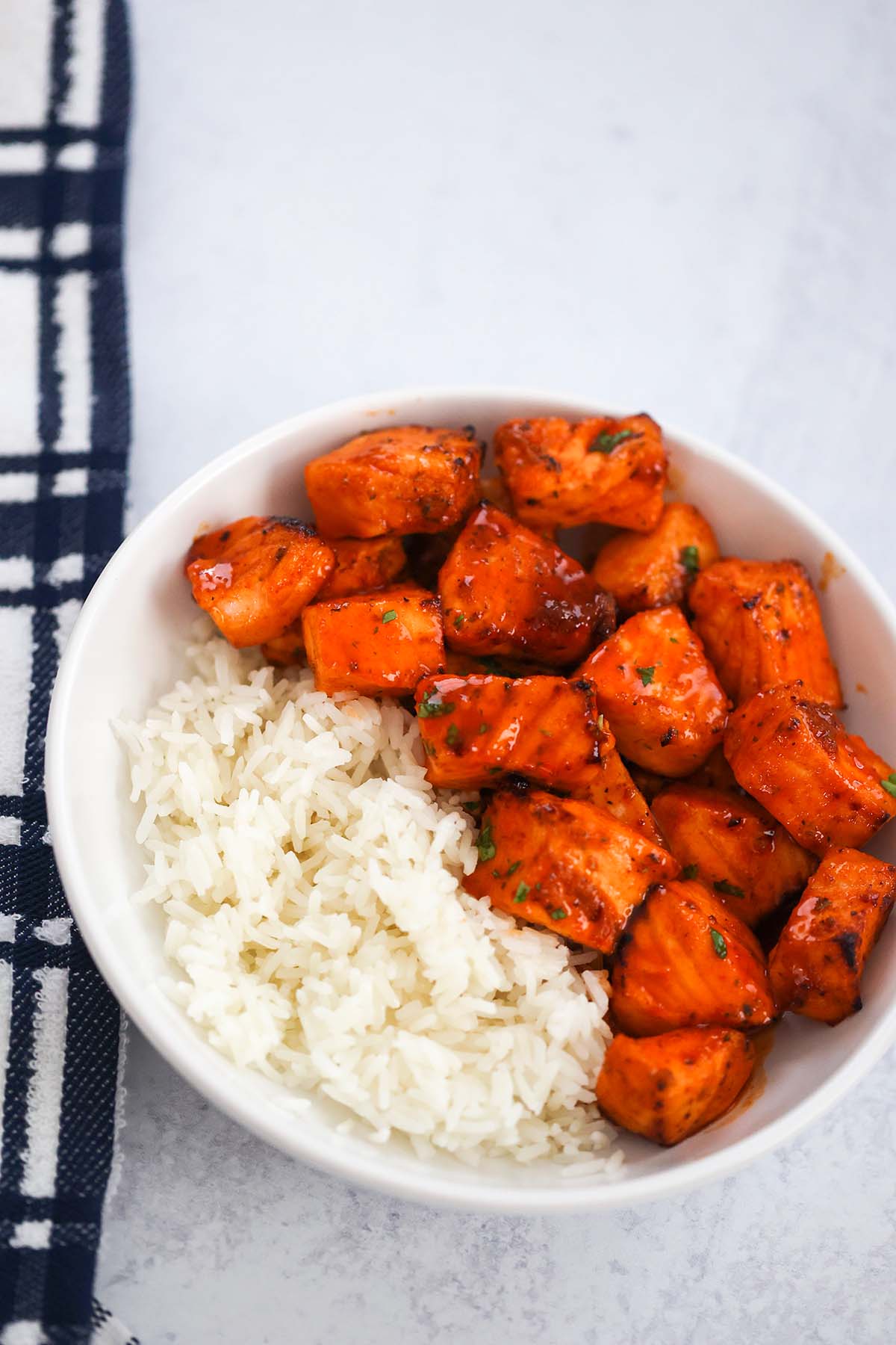 hot honey salmon bites with white rice on the side. 