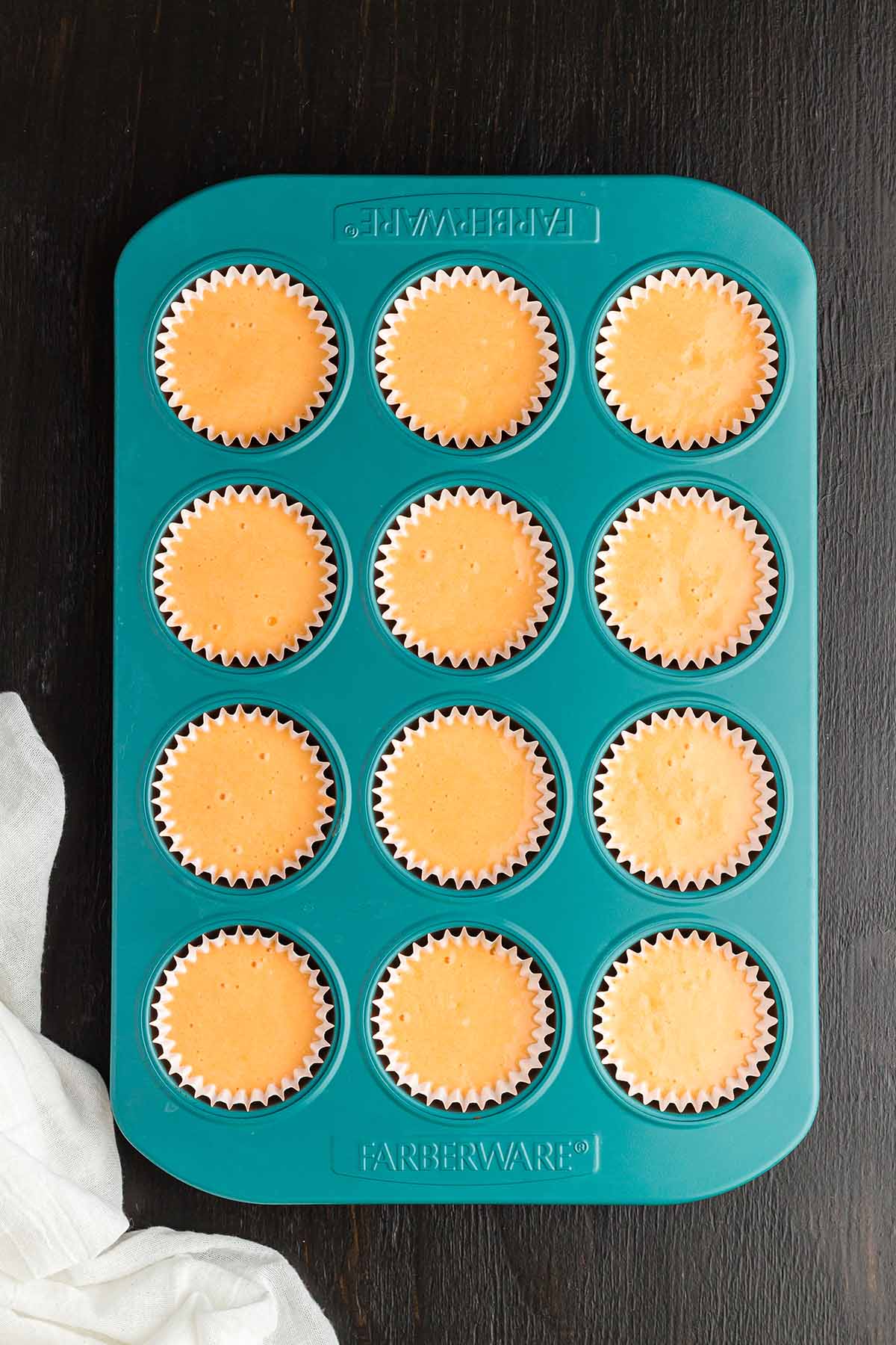cupcake liners filled with batter. 