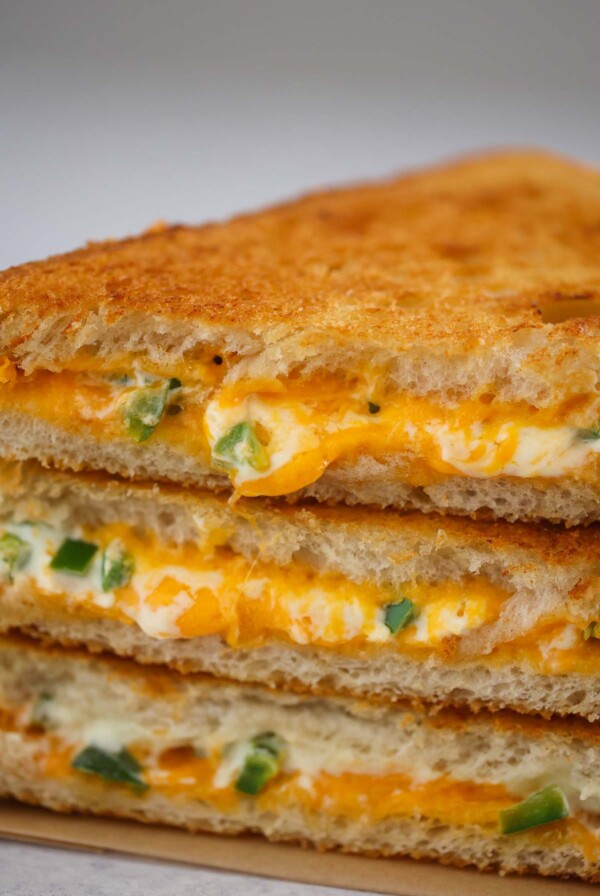 three jalapeno popper grilled cheese sandwiches up close.