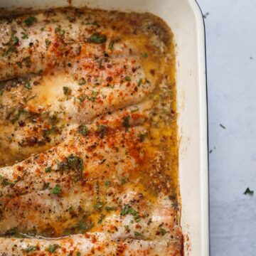 baked tilapia in a baking dish.