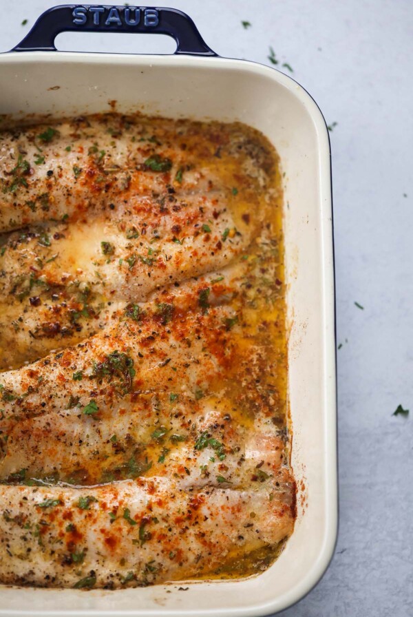 baked tilapia in a baking dish.