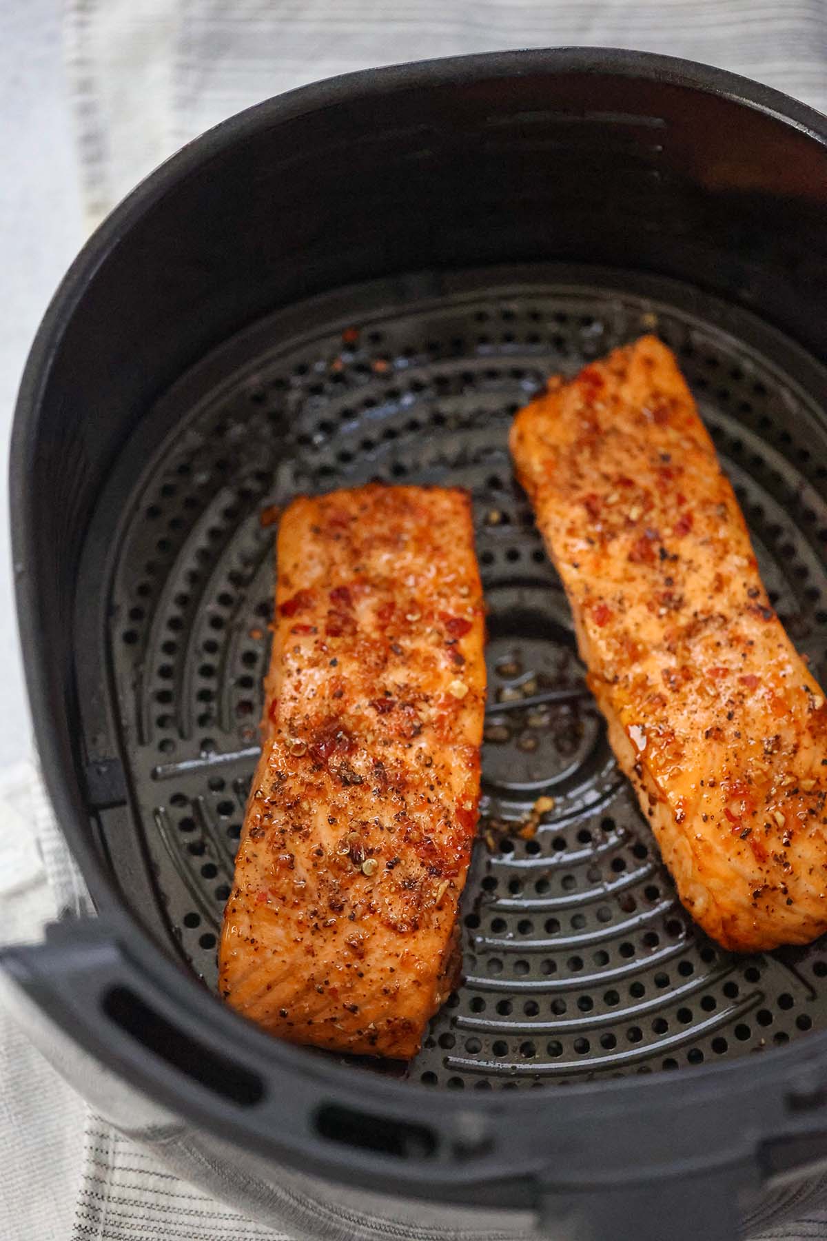 two honey glazed salmon fillets in the air fryer. 