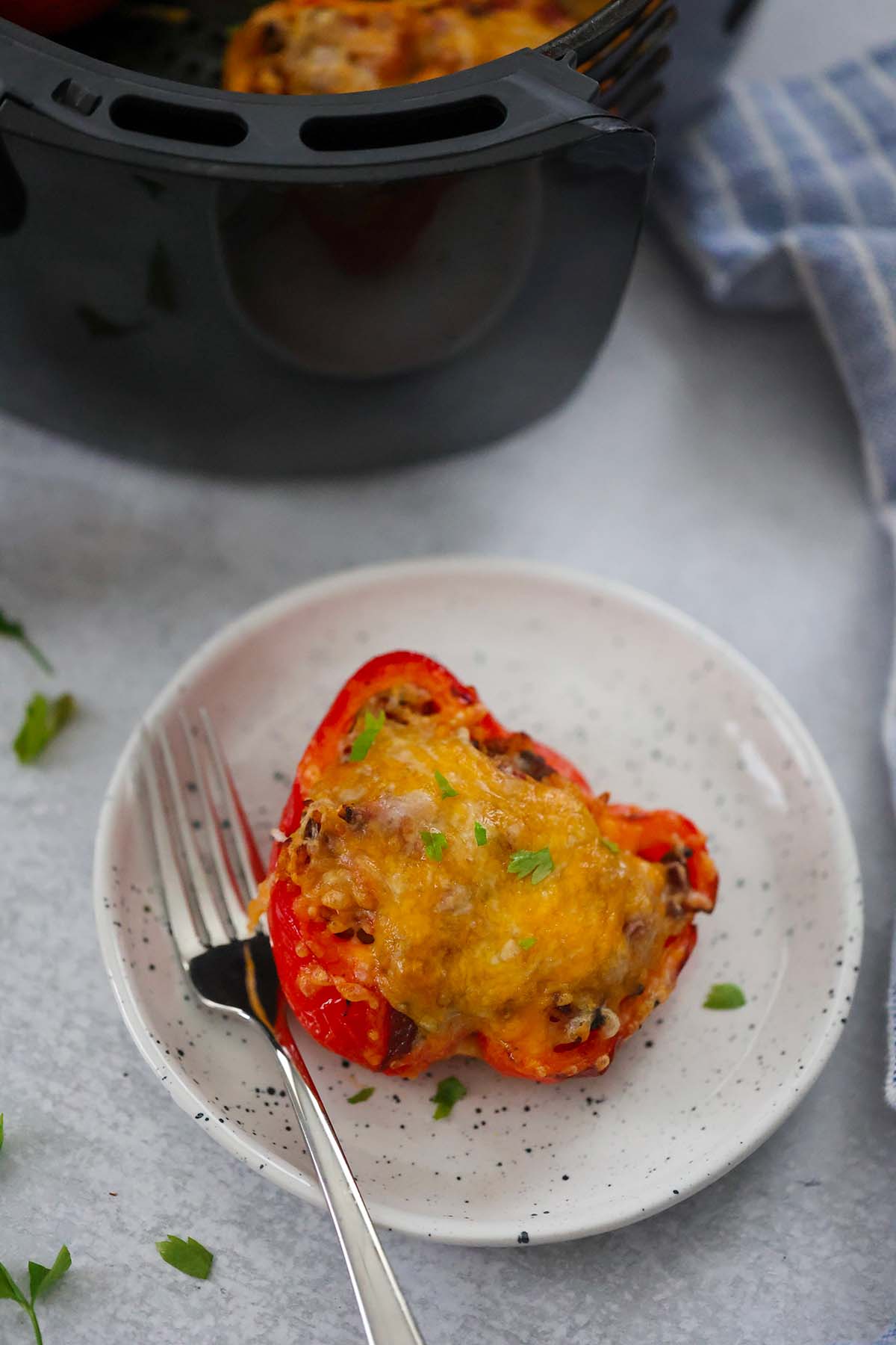 stuffed pepper on a plate with a fork. 