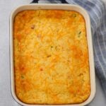 cheesy jalapeno corn casserole in an 8x10 baking dish.