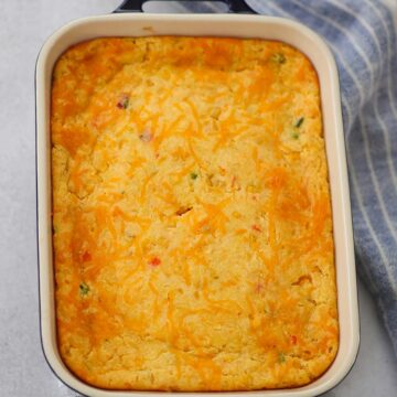 cheesy jalapeno corn casserole in an 8x10 baking dish.