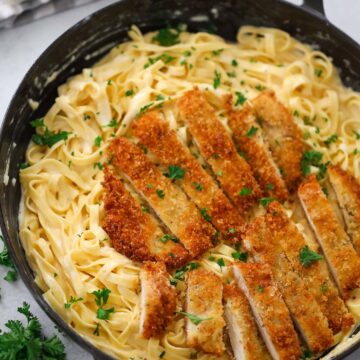 Crispy chicken sliced into bite sized pieces served over creamy Fettuccine Alfredo.