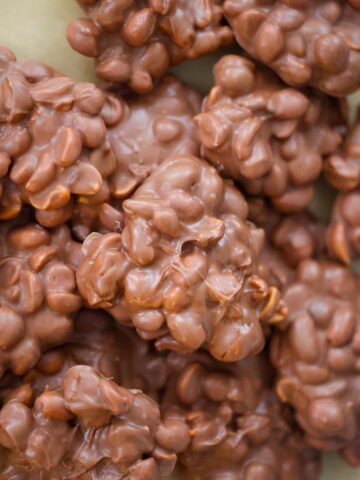 crockpot candy clusters on a baking sheet up close.