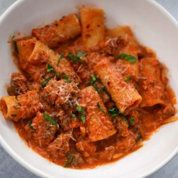 rigatoni with basil and parmesan cheese on top.