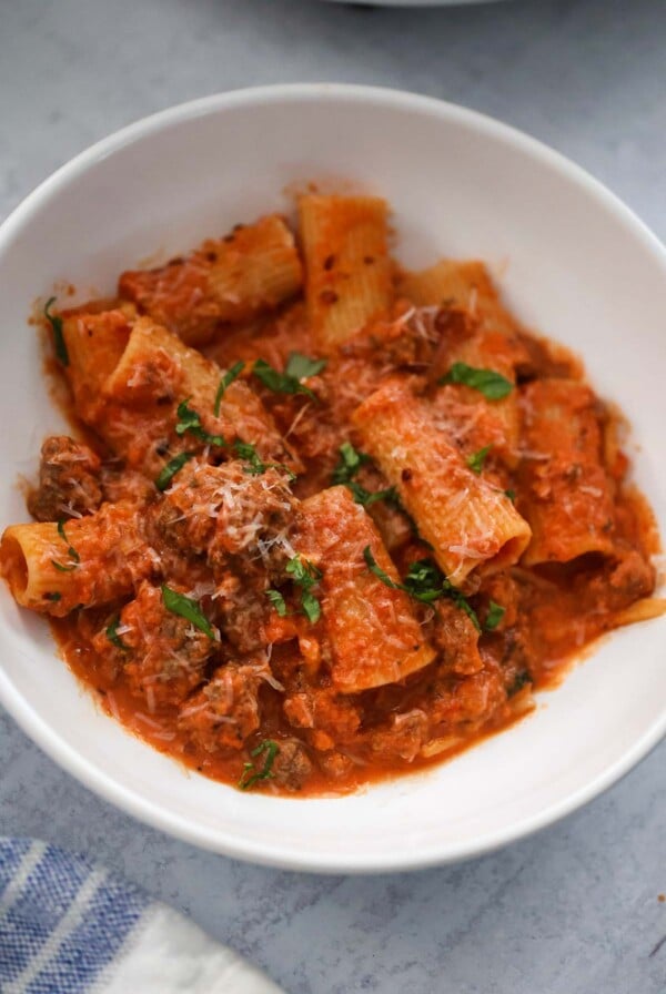 rigatoni with basil and parmesan cheese on top.