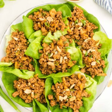 chicken lettuce wraps on a plate.