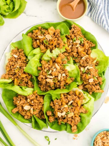 chicken lettuce wraps on a plate.