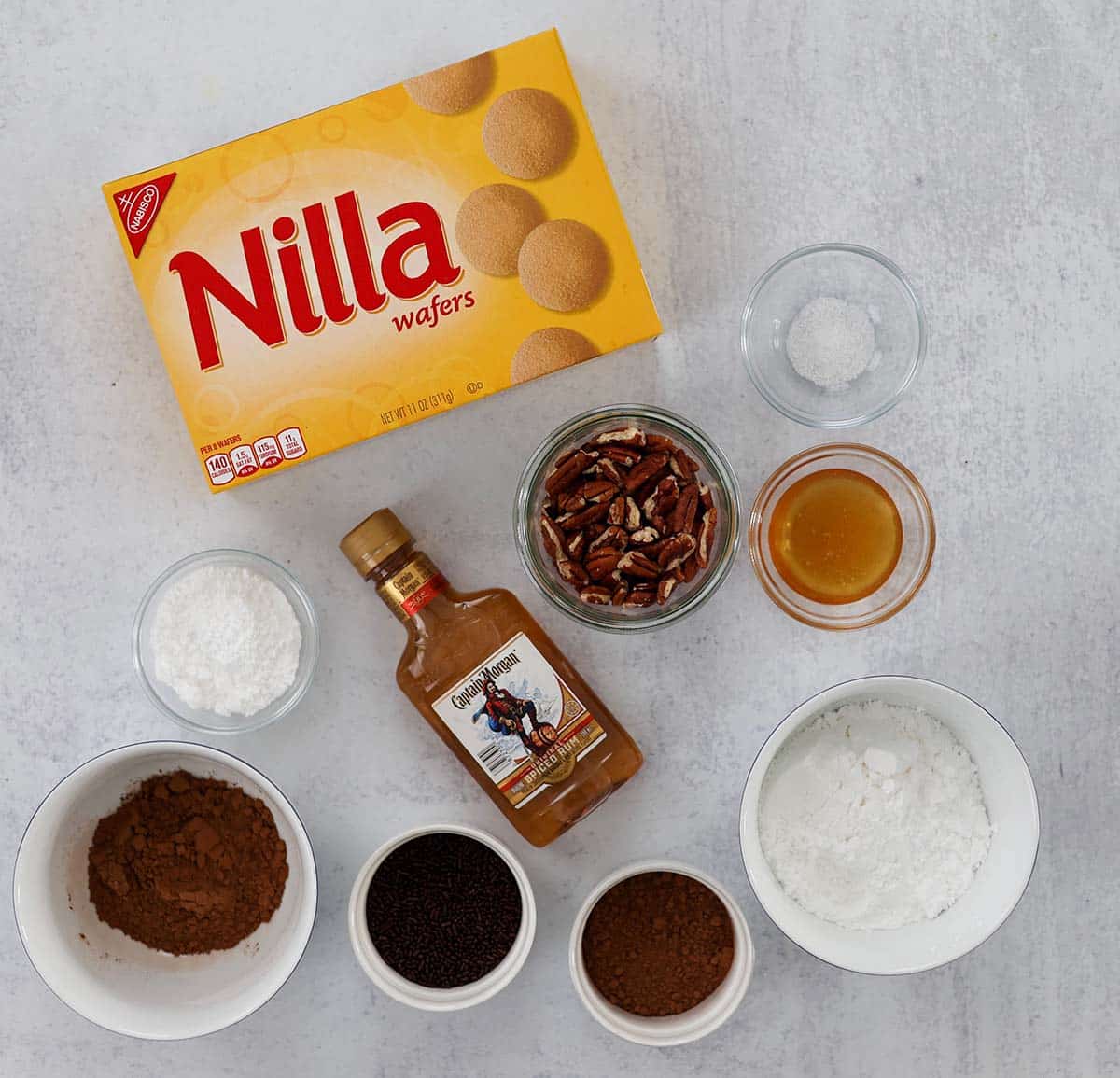 nilla wafers, pecans, sugar, rum, salt, honey, sprinkles, and cocoa powder. 