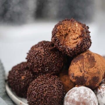 traditional rum balls on a plate.