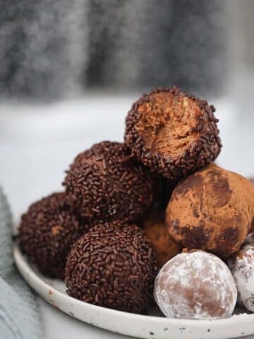 traditional rum balls on a plate.