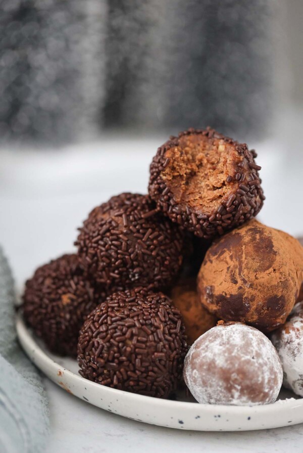 traditional rum balls on a plate.
