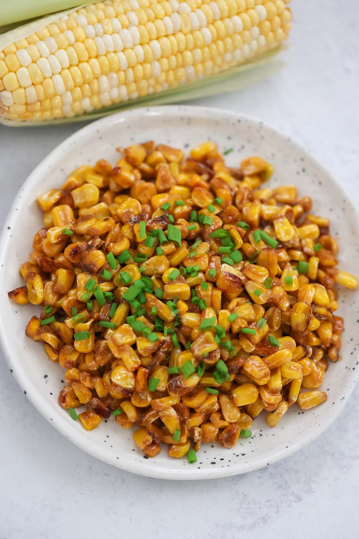 Cajun fried corn with chives on top. 