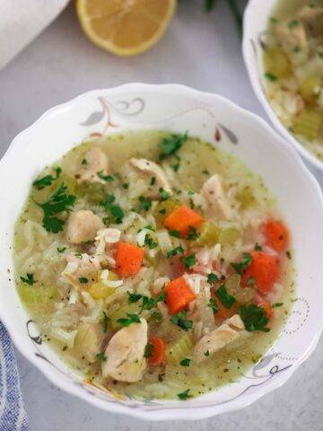 a small bowl of chicken and rice soup up close.
