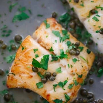 cod piccata in a skillet.