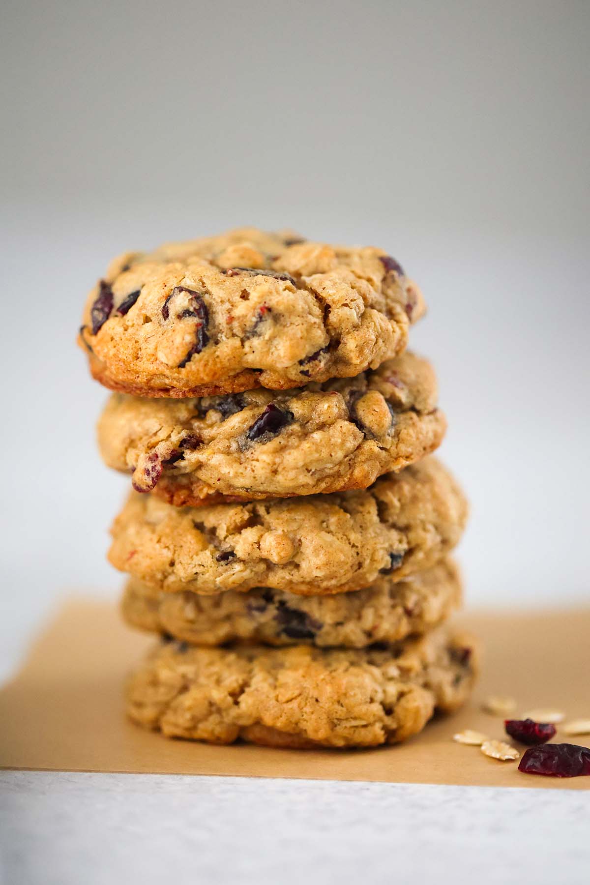 five oatmeal craisin cookies stacked. 