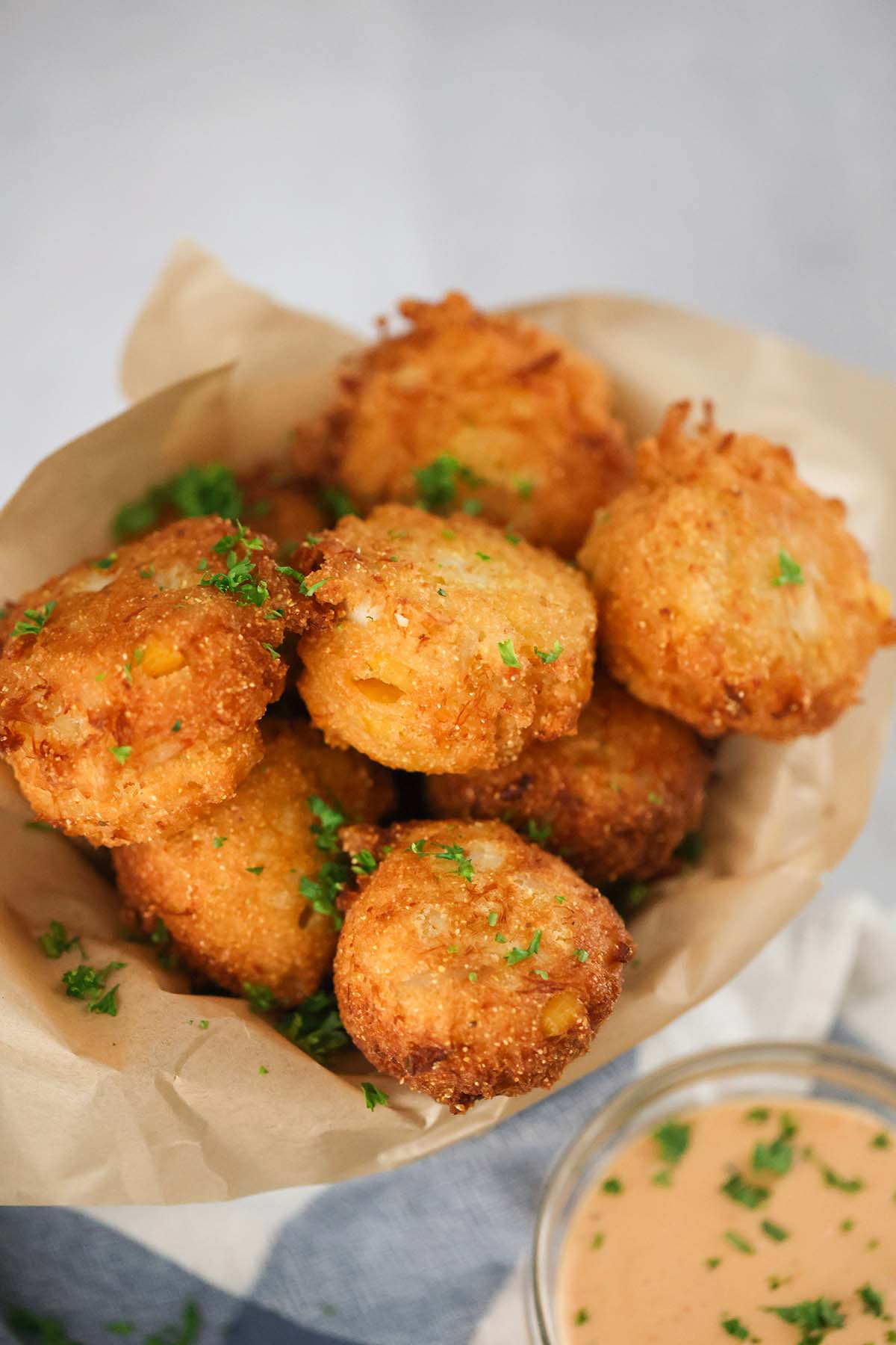 sweet crab hush puppies with sauce on the side. 