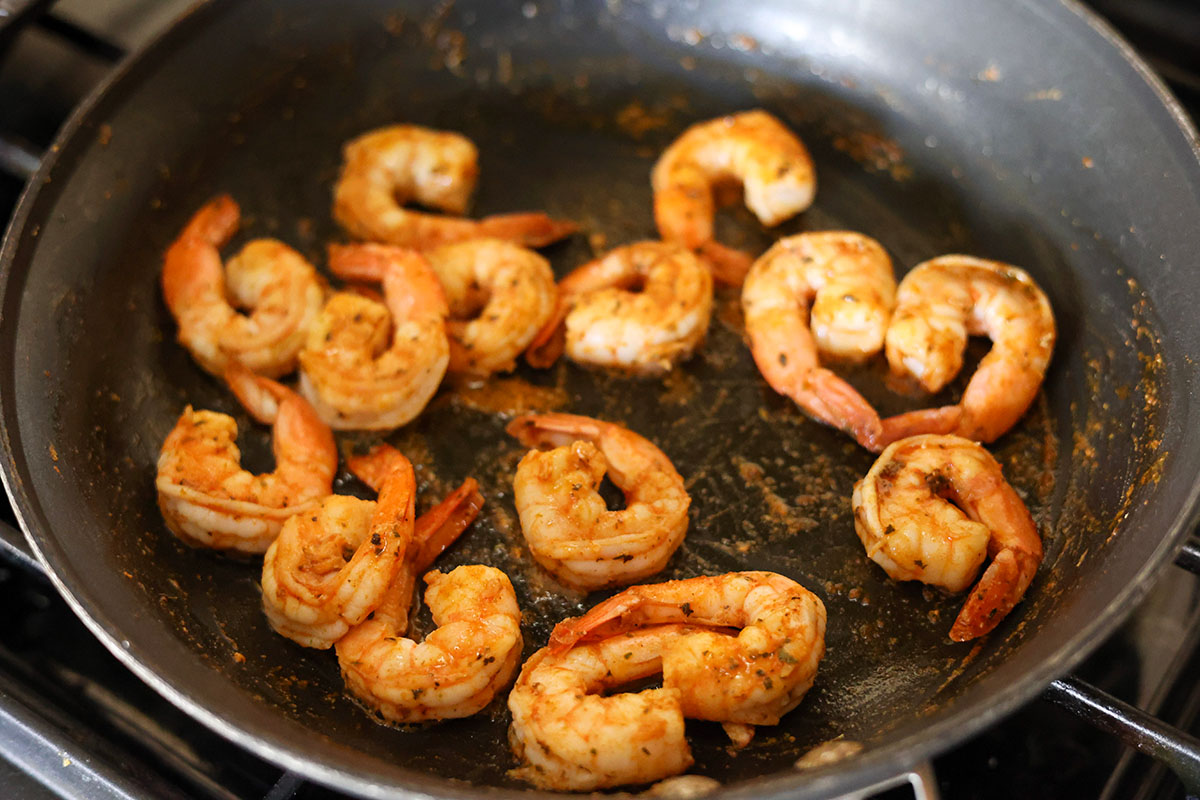 shrimp cooking in a skillet.