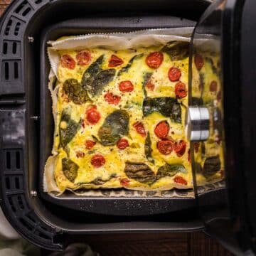 A frittata in an air fryer basket.