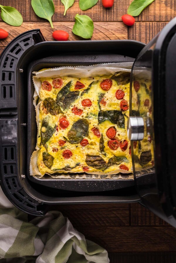 A frittata in an air fryer basket.