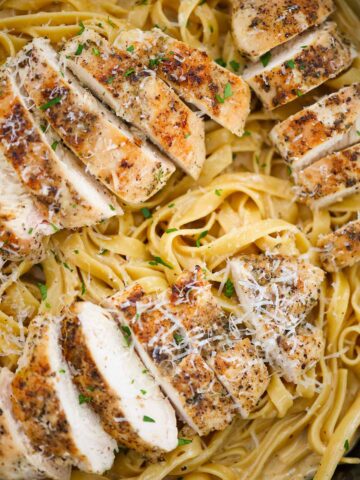 chicken fettuccine alfredo in a skillet.