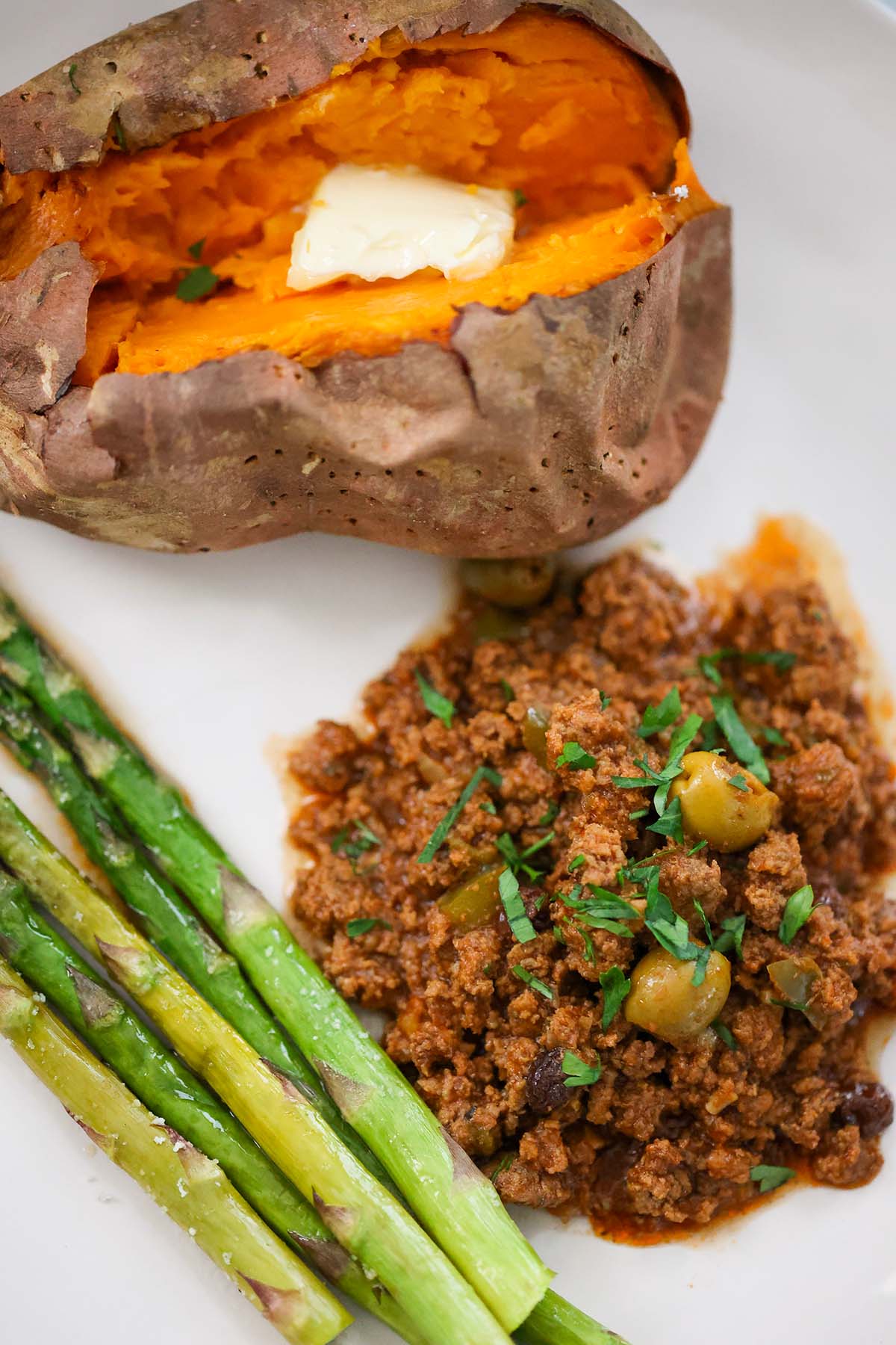 picadillo with sweet potato and asparagus on the side. 