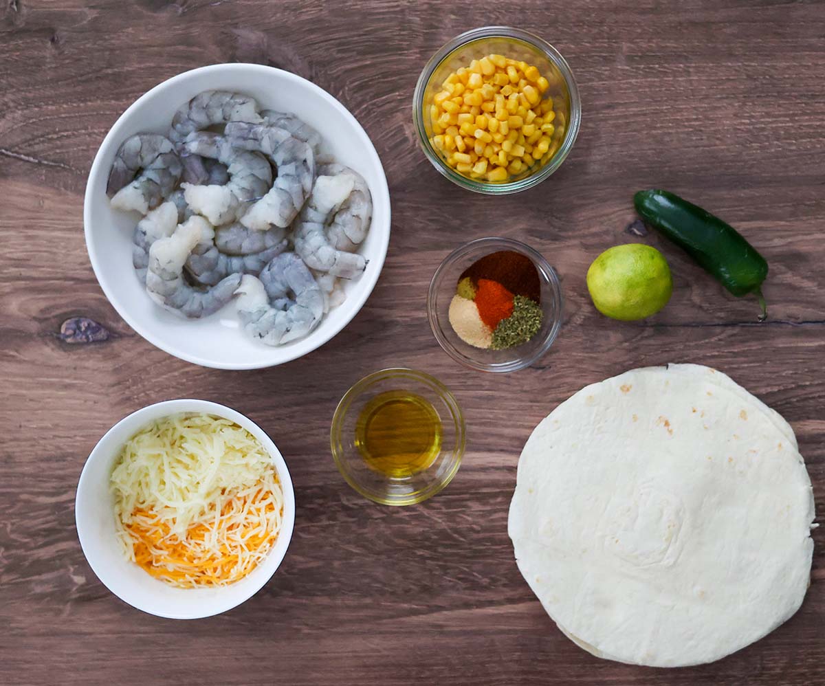 raw shrimp, tortillas, cheese, oil, spices, lime, corn, and jalapeno. 