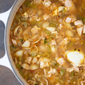 high protein chicken noodle soup in a dutch oven.