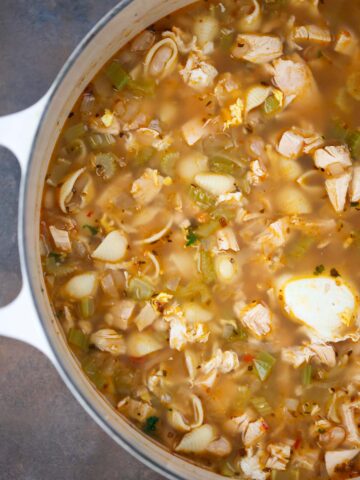 high protein chicken noodle soup in a dutch oven.