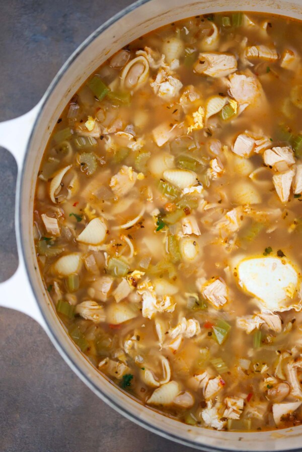high protein chicken noodle soup in a dutch oven.