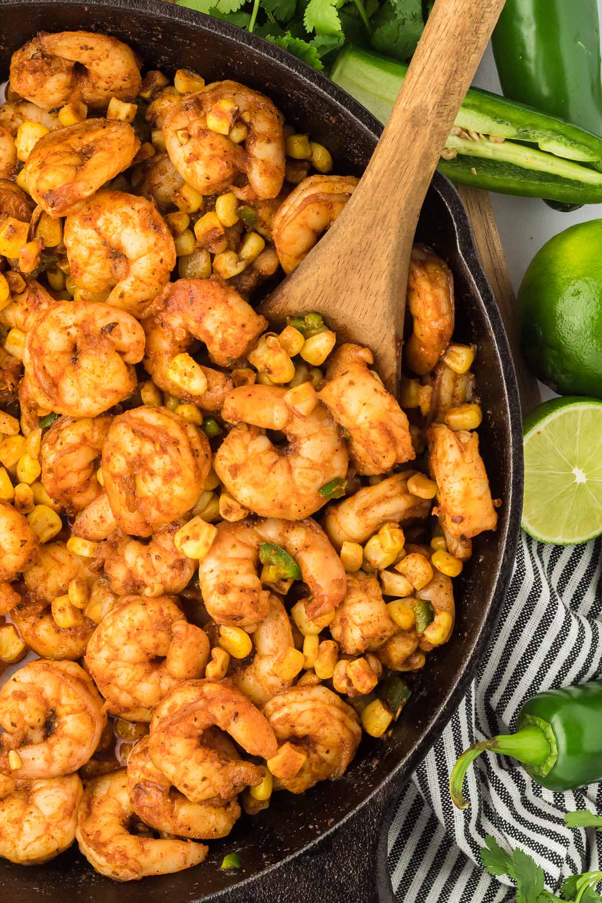 shrimp with corn and jalapenos in a cast iron skillet. 